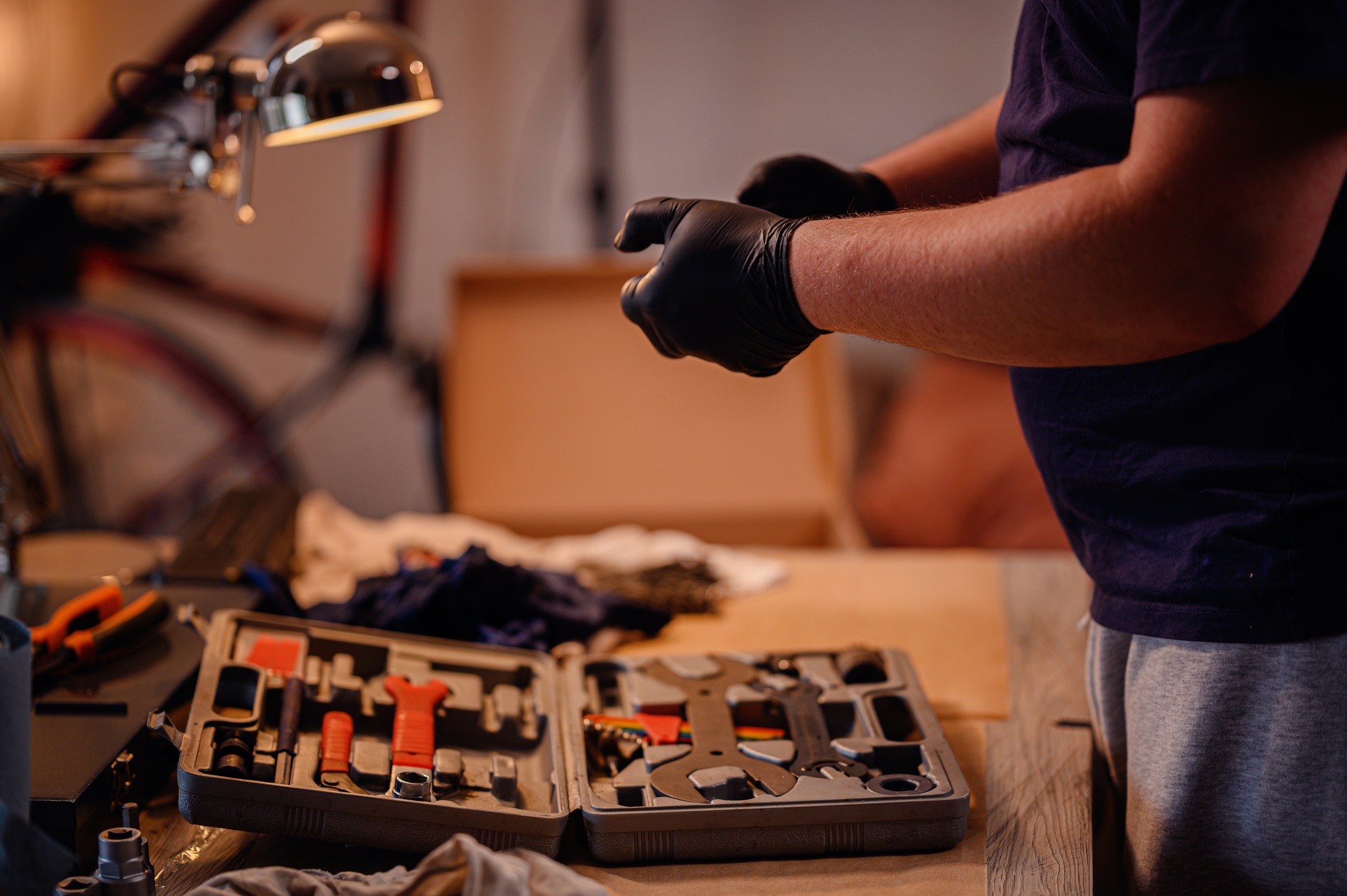 Man Preparing Bike Tools for Maintenance at Home